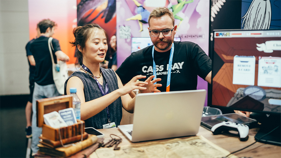 Ben pitching at the booth